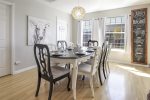 Black and white dining table with black and white chairs seats 8